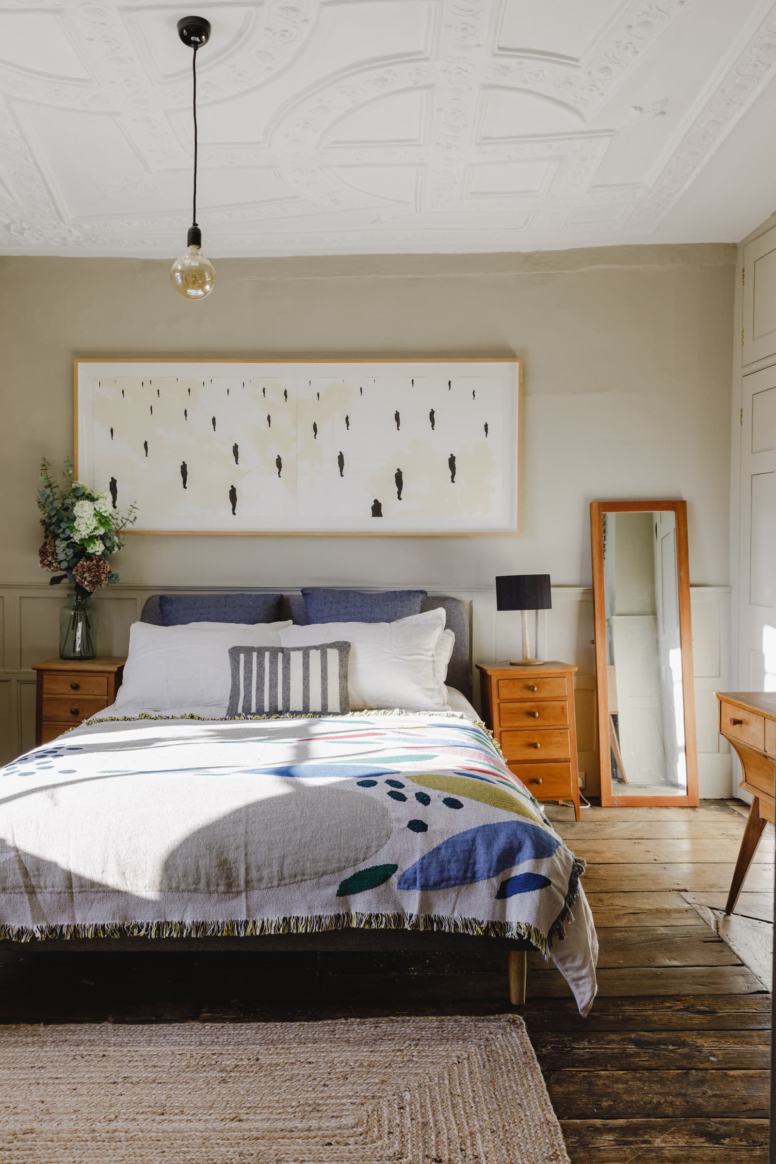 this is a muted gold mid century modern bedroom