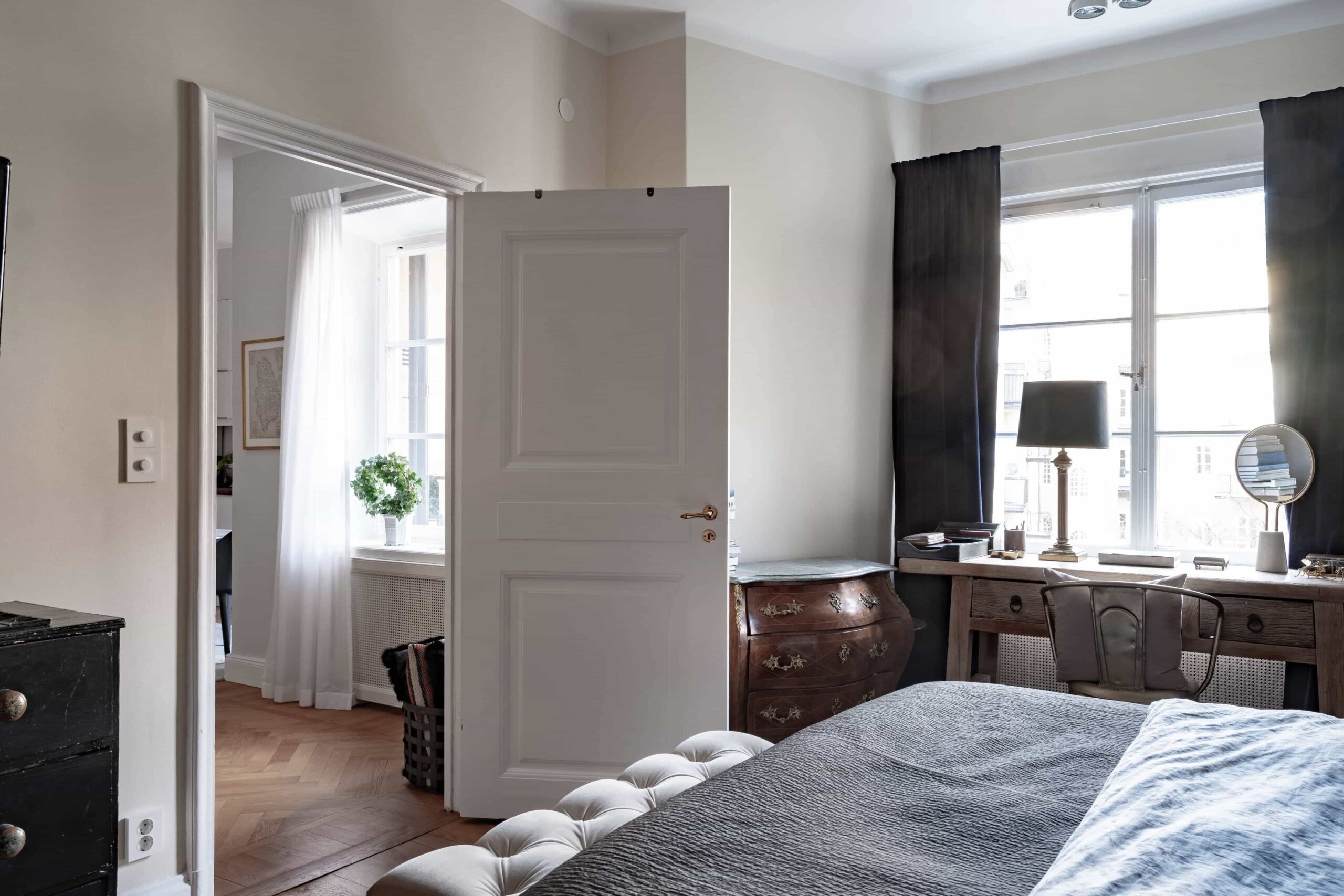 this is a scandinavian bedroom with white and blue colours