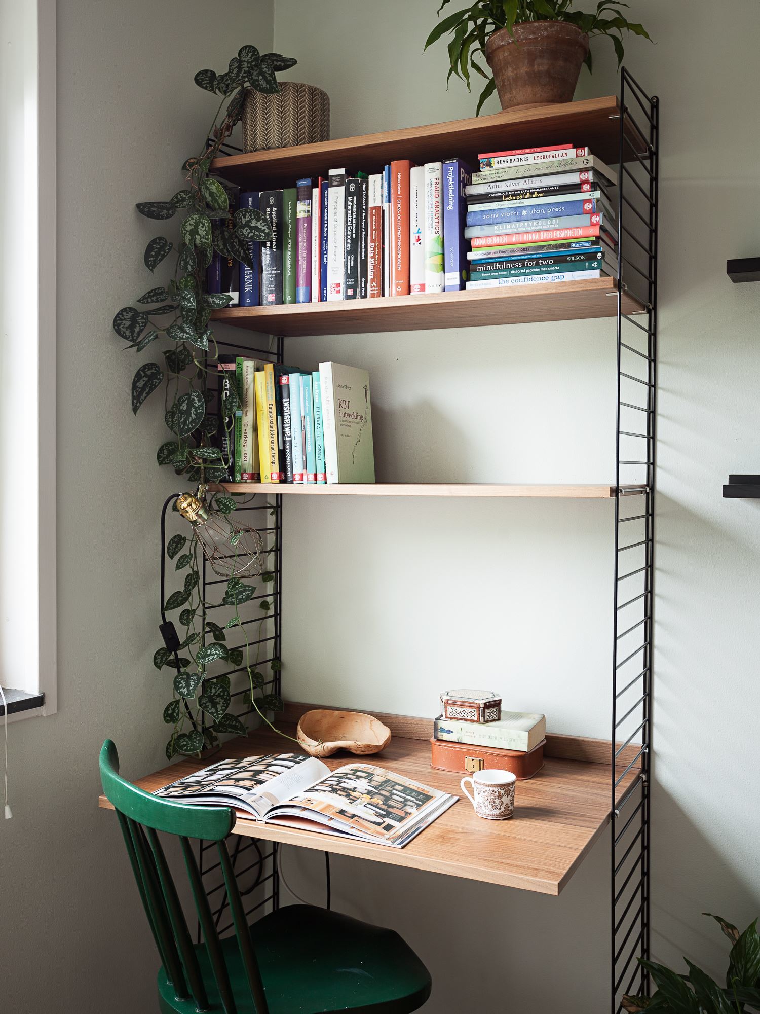 this is a multipurpose home office made with shelves and a desk