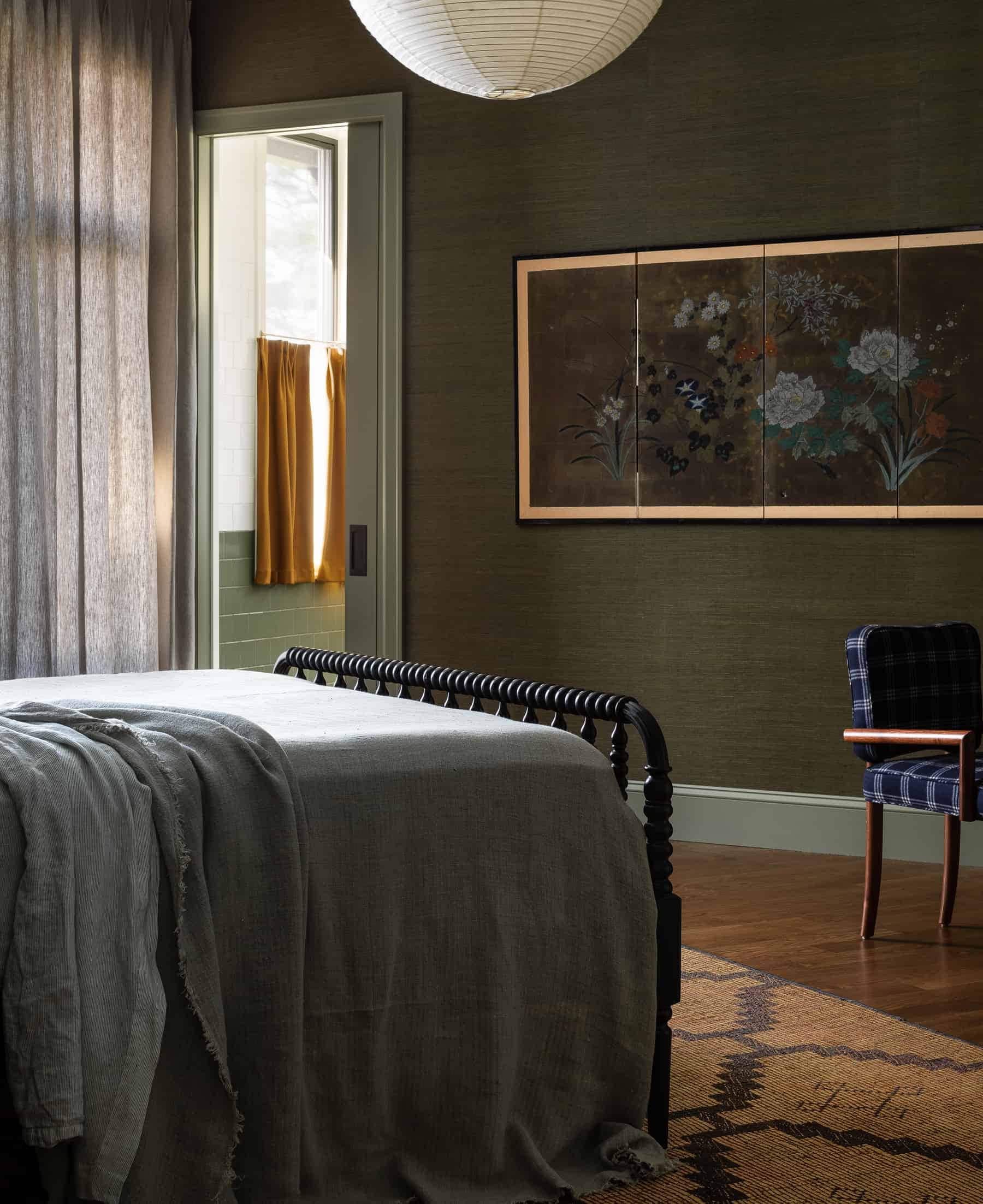 this is an eclectic dark bedroom by heidi caillier with a rich colour palette