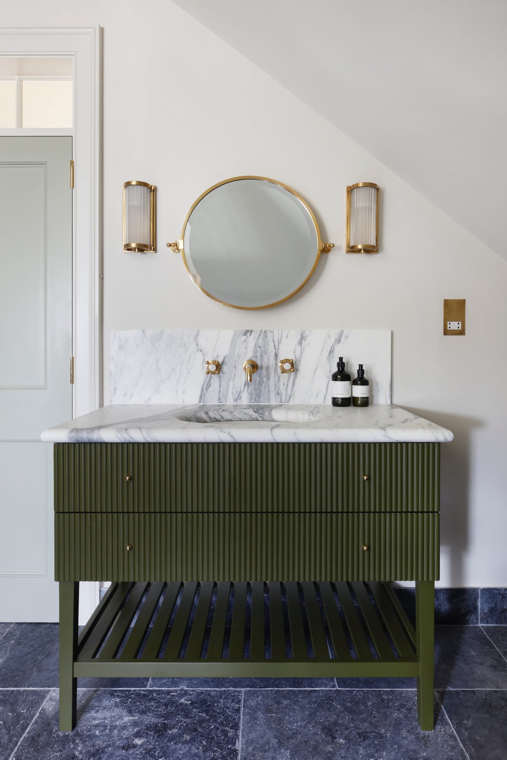 this is a statement green vanity in an eclectic bathroom
