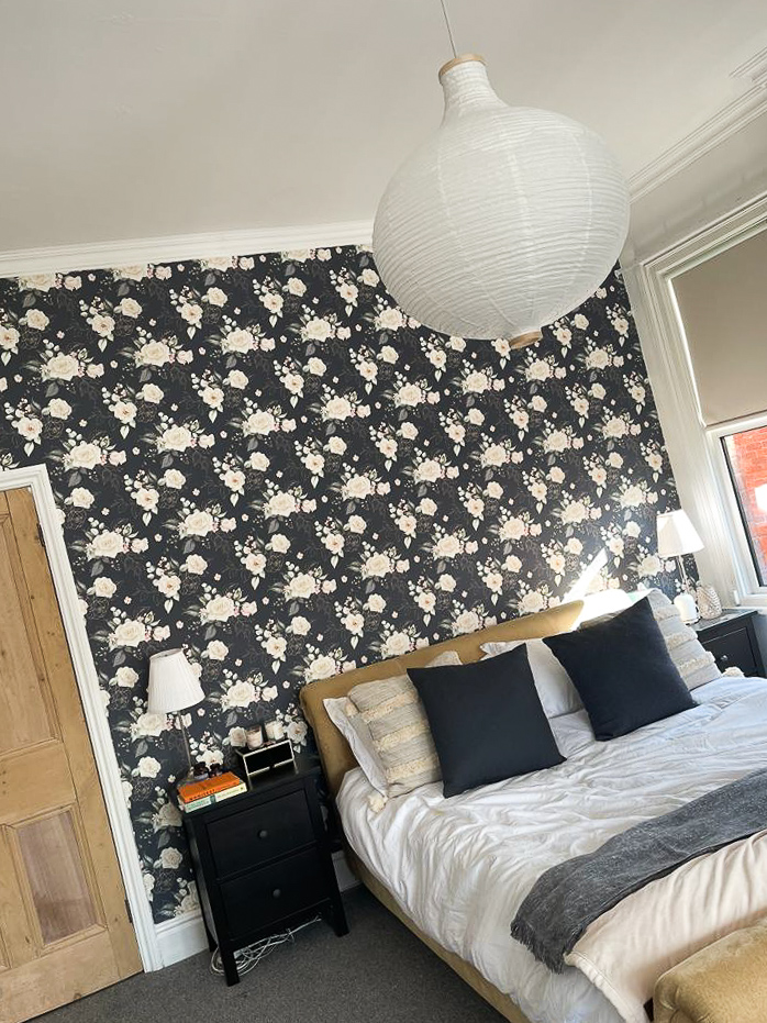 this is the bedroom with a feature wall using bobbi beck trace wallpaper