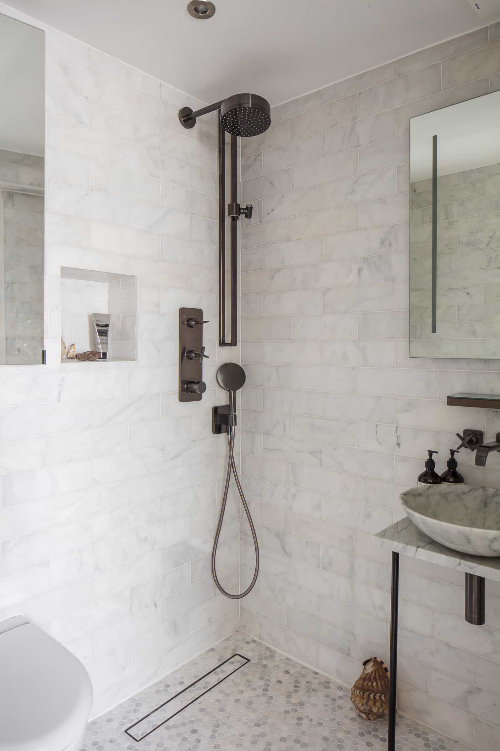 this is an example of sleek shower design in a compact bathroom, featured in the modern house